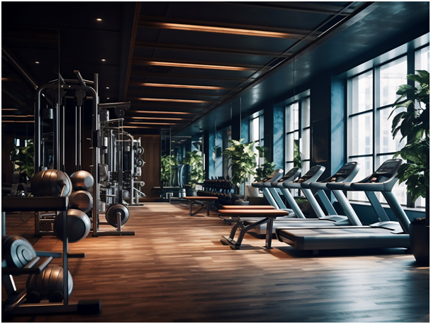 Innenraum eines Fitnessstudios mit Trainingsgeräten und großen Fenstern