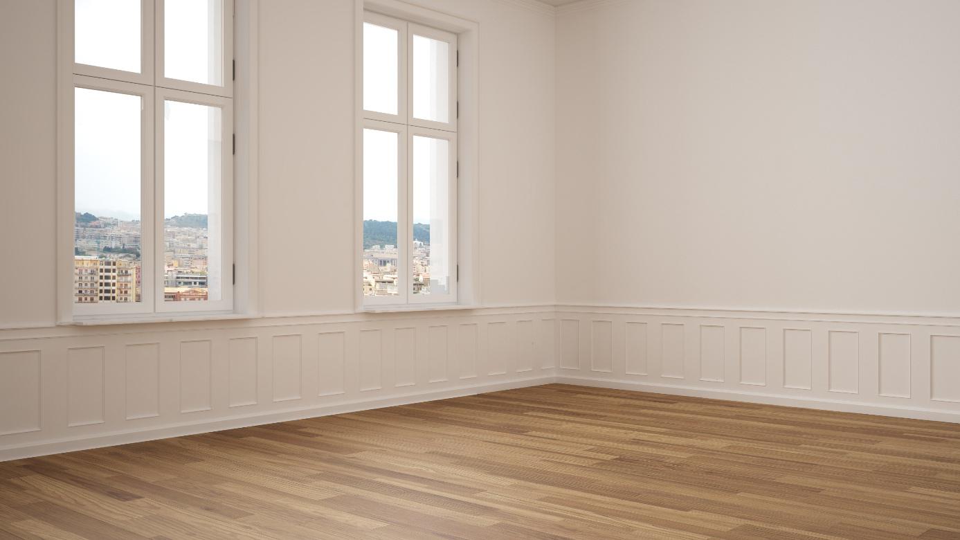 Leeres Zimmer mit Holzparkett und Blick auf eine Stadt durch Kunststofffenster